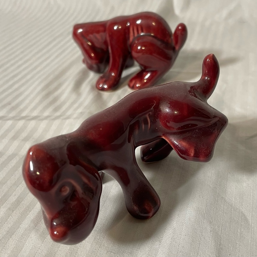 Mid century, burgundy, naughty Dog Camark pottery Figurines